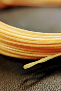 Mango Image of a coiled fly line on a leather background